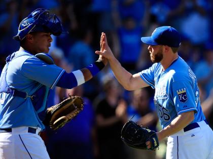 Greg Holland (right) has 37 saves for the Royals. (Getty)