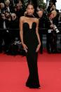 <p>Laura Harrier and Saint Laurent are a match made in heaven. The actress looked elegant and effortlessly cool in a black gown by the house, which featured the signature neckline and scarf detail.</p>