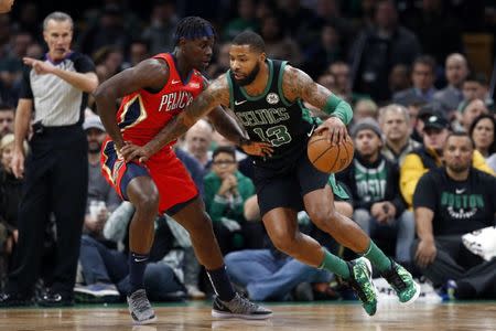 Dec 10, 2018; Boston, MA, USA; Boston Celtics forward Marcus Morris (13) drives against New Orleans Pelicans guard Jrue Holiday (11) during the first half at TD Garden. Greg M. Cooper-USA TODAY Sports