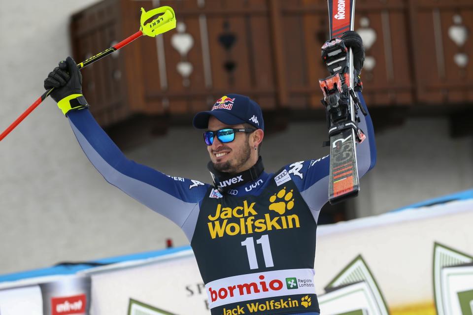 Italy's Dominik Paris celebrates winning an alpine ski, men's World Cup downhill, in Bormio, Italy, Friday, Dec. 27, 2019. (AP Photo/Alessandro Trovati)