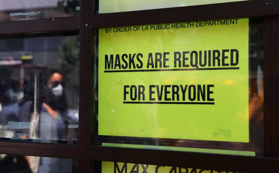 Sign reading "MASKS ARE REQUIRED FOR EVERYONE"