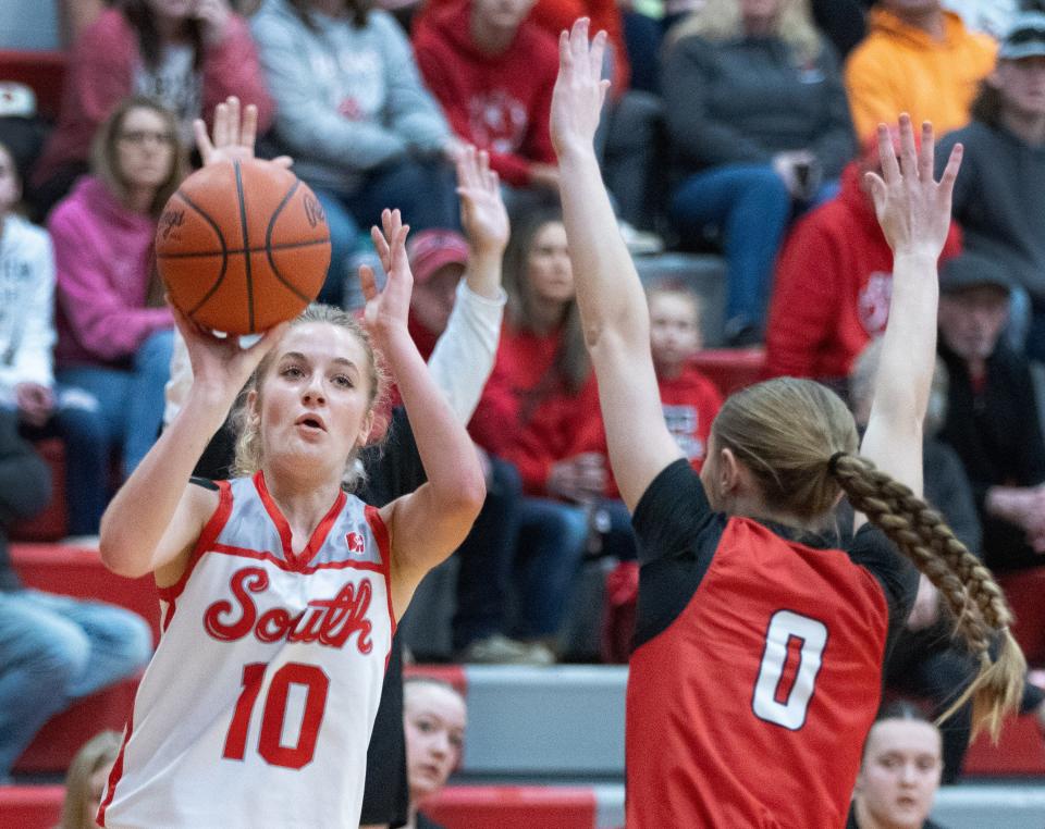 Canton South’s Sydney Comer shoots a 3-pointer over Field’s Nema Macamis on Saturday, Feb. 24, 2024.