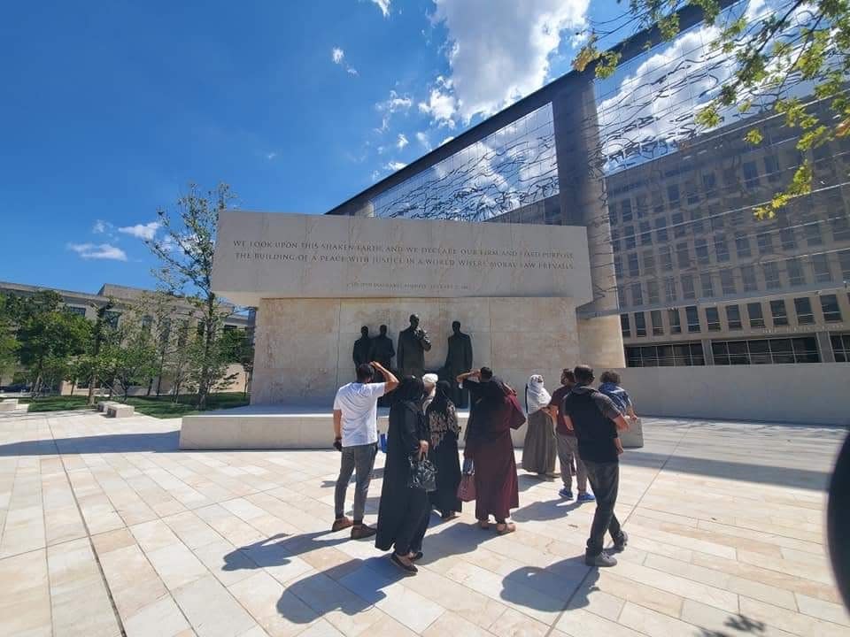 The Siddiqi and Rester families stop to view the Eisenhower Memorial in Washington, D.C., on the way home to Fayetteville from the Philadelphia airport.