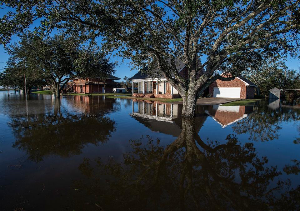 Flood waters surround houses in Delcambre, La., on Saturday Oct. 10, 2020 after Hurricane Delta hit the Louisiana Coast. 