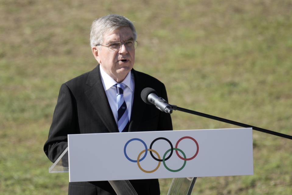 IOC President Thomas Bach delivers a speech before the lighting of the Olympic flame at Ancient Olympia site, birthplace of the ancient Olympics in southwestern Greece, Monday, Oct. 18, 2021. The flame will be transported by torch relay to Beijing, China, which will host the Feb. 4-20, 2022 Winter Olympics. (AP Photo/Petros Giannakouris)