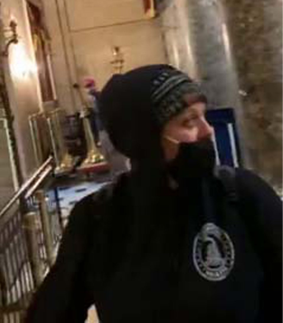 In this screenshot embedded in a federal court document, Virginia Spencer appears in a video recorded by husband Chris inside Statuary Hall during the attack on the U.S. Capitol on Jan. 6, 2021.