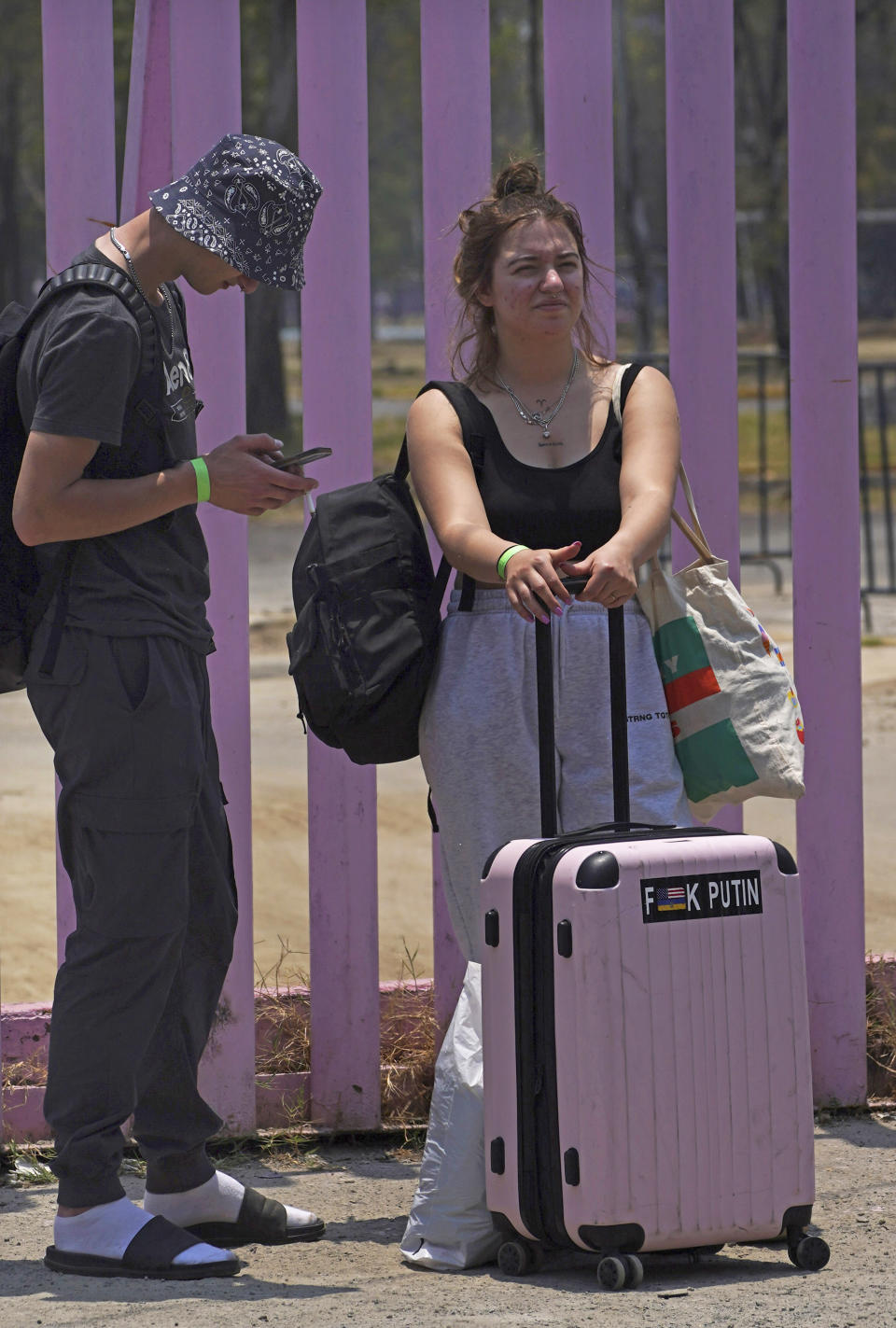 Mykhailo Pastenak, left, who is a Ukrainian-American and his girlfriend who is a Ukrainian refugee Maziana Hzyhozyshyn, arrive at a refugee camp at Utopia Park camp in Iztapalapa, Mexico City, Monday, May 2, 2022. Pastenak is helping Hzyhozyshyn through the refugee process so that she can make it to the United States faster. (AP Photo/Marco Ugarte)