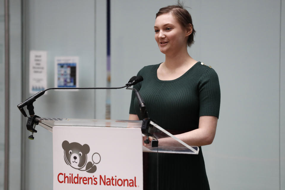 Caoilinn McLane, who is a patient at Children's National Hospital, introduces first lady Melania Trump before the first lady read a Christmas story to children at Children's National Hospital, Friday, Dec. 6, 2019. (AP Photo/Jacquelyn Martin)