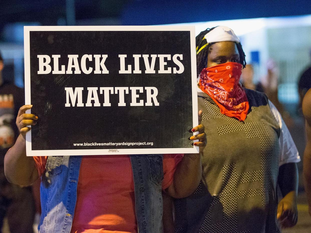 Black Lives Matter protesters in Ferguson in 2015 on the anniversary of Michael Brown's death: Getty Images