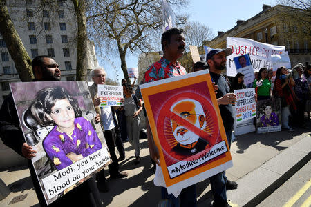 Demonstrators stage a protest against the visit by India's Prime Minister Narendra Modi opposite Downing Street in London, Britain, April 18, 2018. REUTERS/Toby Melville