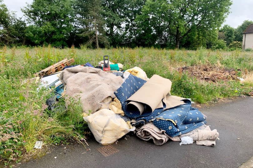 Piles of rubbish lying on the street