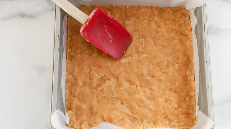 coconut bar crust pressed into a pan