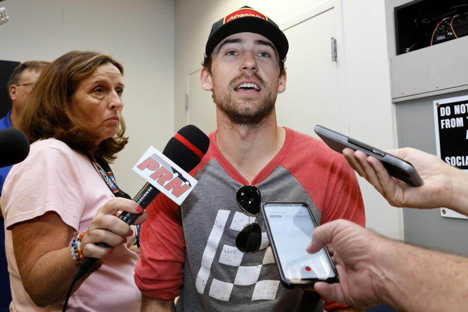 Ryan Blaney answers questions from reporters during a media availability before a NASCAR Cup Series auto race at Daytona International Speedway, Friday, Aug. 26, 2022, in Daytona Beach, Fla. (AP Photo/Terry Renna)