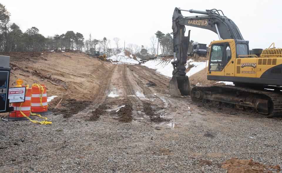 Heavy equipment clears and grades land on Feb. 23 for a future Davenport Companies housing development off Route 6A in Yarmouth Port. Davenport plans to build 14 single-family homes for year-round rentals for Cape Cod residents.