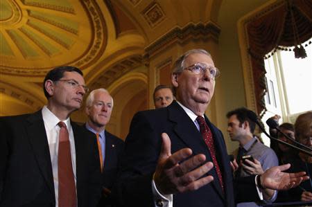 U.S. Senate Minority Leader Mitch McConnell (R-KY) speaks to the media following a Senate cloture vote on budget bill on Capitol Hill in Washington December 17, 2013. REUTERS/Yuri Gripas