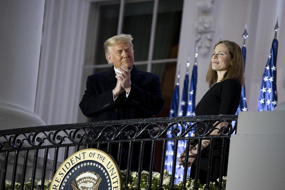 US President Donald Trump stands with newly sworn in Supreme Court Justice Amy Coney Barrett: Getty Images