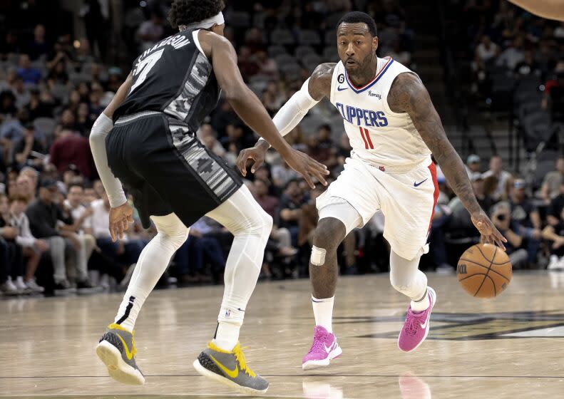 Los Angeles Clippers guard John Wall (11) drives against San Antonio Spurs guard Josh Richardson.
