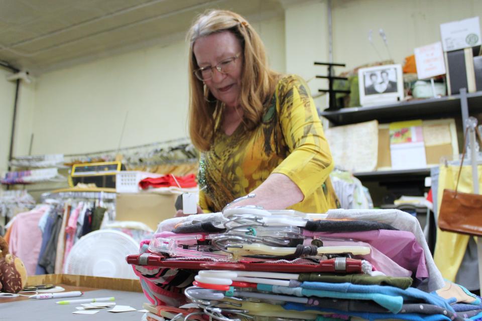 A variety of places in Monroe, like Thrift Shop Association of Monroe, 119 S. Monroe St., accept donations. Pictured is Lorey Roop of Monroe tagging inventory before it's put out for sale.