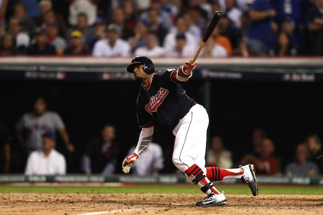 Cleveland's Rajai Davis cartwheels out of the box after being hit