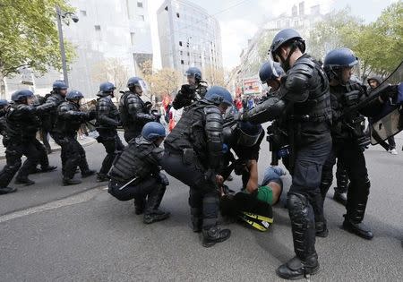 French riot Gendarmes detain a protestor during a demonstration against the French labour law proposal in Lyon, France, as part of a nationwide labor reform protests and strikes, April 28, 2016. REUTERS/Robert Pratta