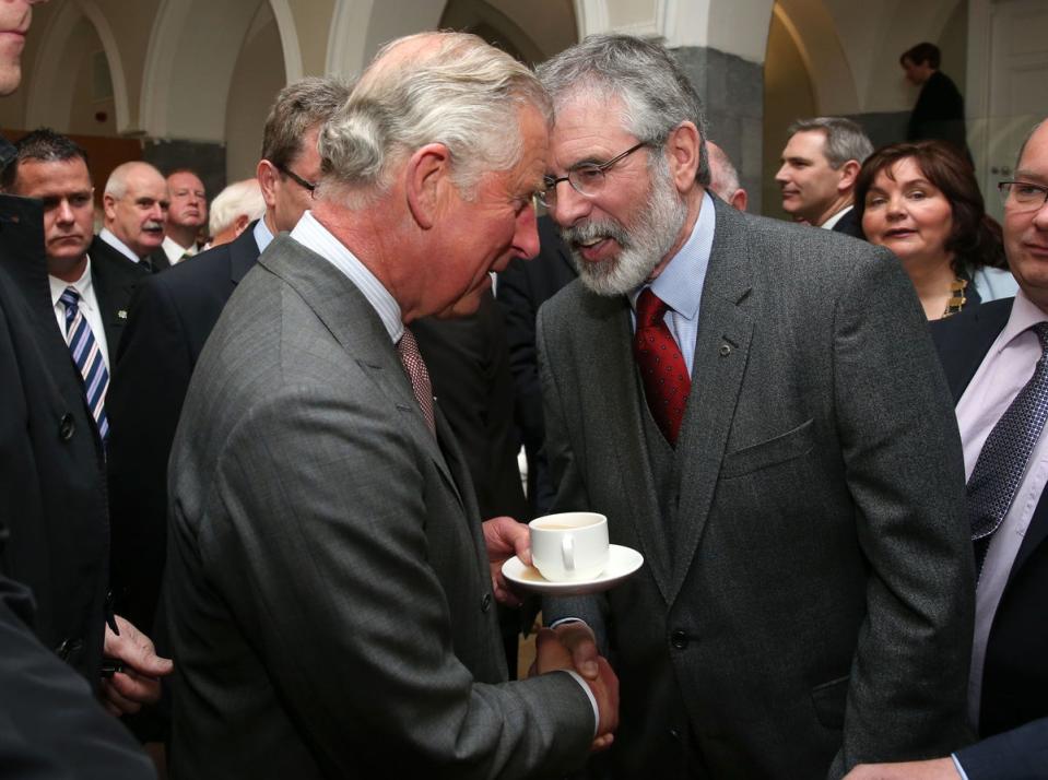 The Prince of Wales (left) shakes hands with Sinn Fein president Gerry Adams at the National University of Ireland in Galway, Ireland (Brian Lawless/PA) (PA Archive)