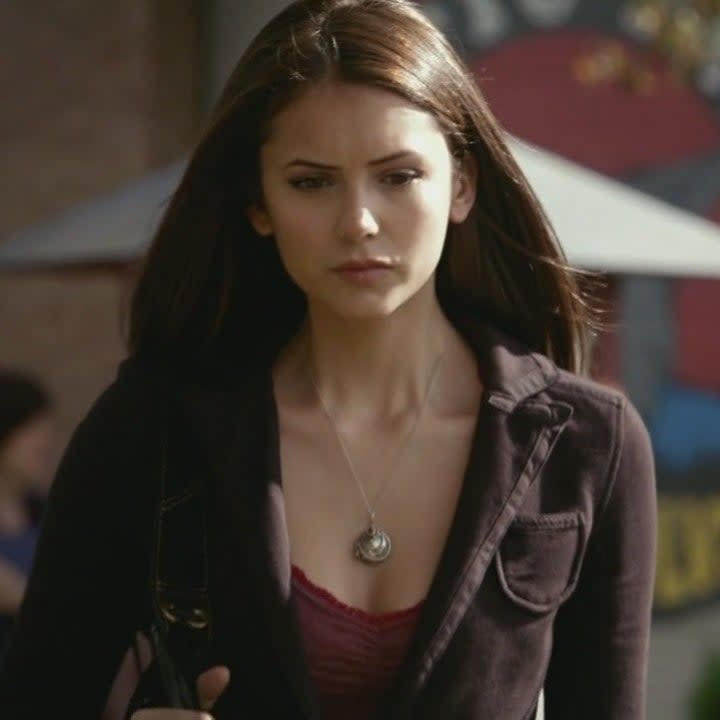 Elena walking towards Stefan