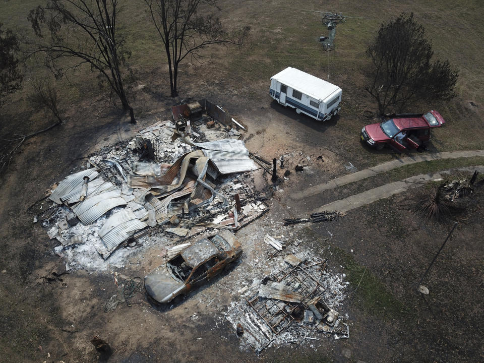 The home of Lyle Stewart is razed to the ground at Nerrigundah, Australia, Monday, Jan. 13, 2020, after a wildfire ripped through the town on New Year's Eve. The tiny village of Nerrigundah in New South Wales has been among the hardest hit by Australia's devastating wildfires, with about two thirds of the homes destroyed and a 71-year-old man killed. (AP Photo/Sam McNeil)