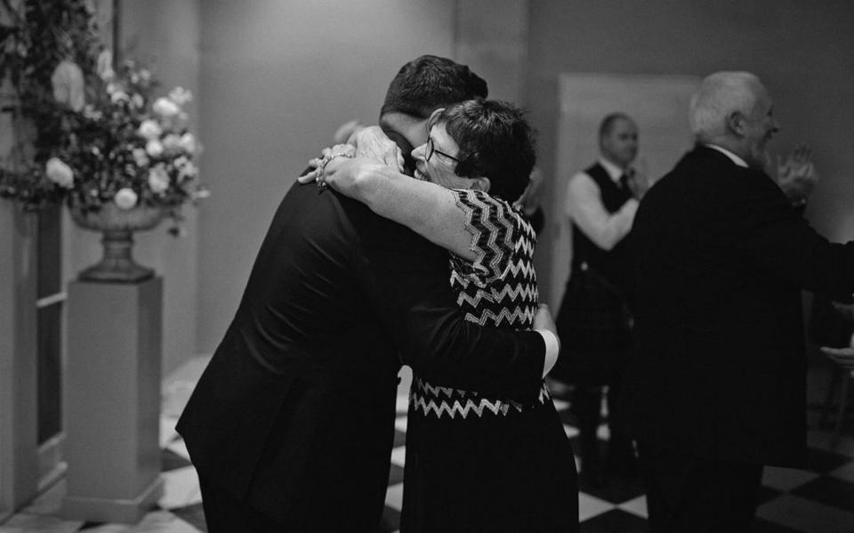 Jamie George hugs his mother on her wedding day