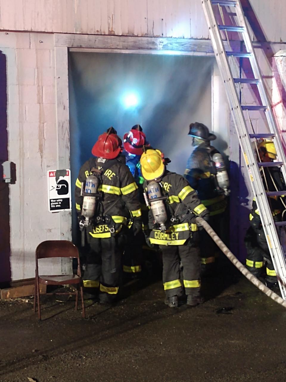 Firefighters battle a blaze that destroyed the former Babcock Ladder Factory, currently owned by Clark’s Specialty Company, at 36 Delaware Ave. in Bath Monday night into Tuesday morning.