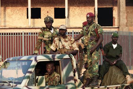 Ex-Seleka soldiers patrol a neighbourhood atop a truck in Bangui December 22, 2013. REUTERS/Andreea Campeanu