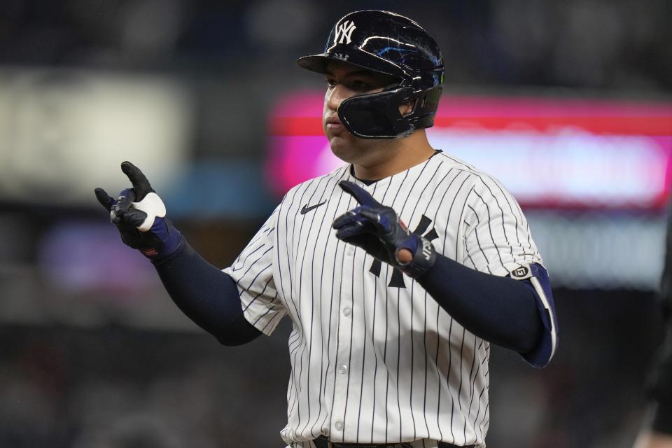 New York Yankees' Jose Trevino gestures to his dugout after hitting a single during the fourth inning of a baseball game against the Houston Astros, Tuesday, May 7, 2024, in New York. (AP Photo/Frank Franklin II)