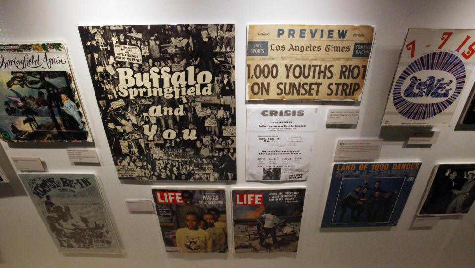 This March 26, 2012 photo shows a portion of the exhibit, "Trouble In Paradise: Music and Los Angeles, 1945-1975," at the Grammy Museum in downtown Los Angeles. The museum website says the exhibit focuses on the "tensions between alluring myths of Southern California paradise and the realities of social struggle that characterized the years following WWII." (AP Photo/Reed Saxon)