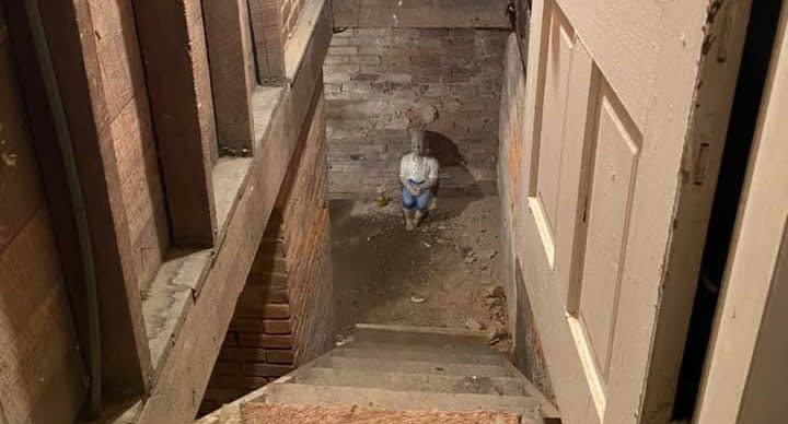 A statue sits in a basement in a home in West Virginia.