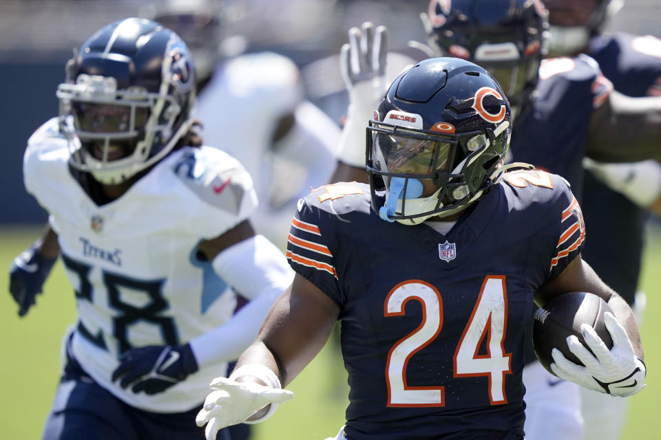 Chicago Bears running back Khalil Herbert (24) runs for a touchdown against the Tennessee Titans during the first half of an NFL preseason football game, Saturday, Aug. 12, 2023, in Chicago. (AP Photo/Charles Rex Arbogast)
