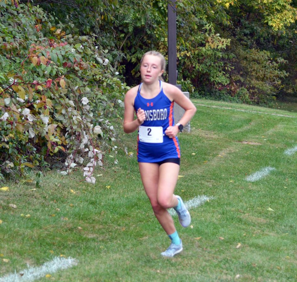 Boonsboro's Caroline Matthews is all alone in first place with a mile to go at the 32nd Don Stoner Invitational at Smithsburg on Oct. 12, 2022.