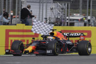 Red Bull driver Max Verstappen of the Netherlands crosses the finish line to win the Emilia Romagna Formula One Grand Prix, at the Imola racetrack, Italy, Sunday, April 18, 2021. (AP Photo/Luca Bruno)