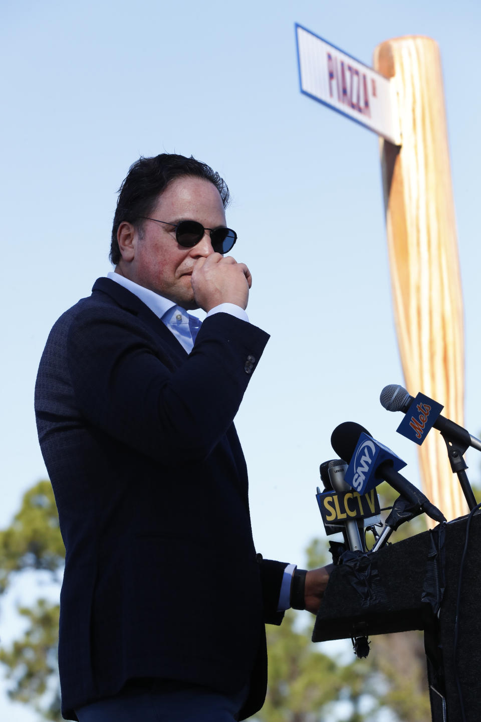 Former New York Mets catcher Mike Piazza chokes up as he talks about his father as he speaks during a ceremony after the unveiling of newly named Piazza Dr., in front of the Mets spring training facility, Thursday, Jan. 16, 2020, in Port St. Lucie, Fla. (AP Photo/Wilfredo Lee)