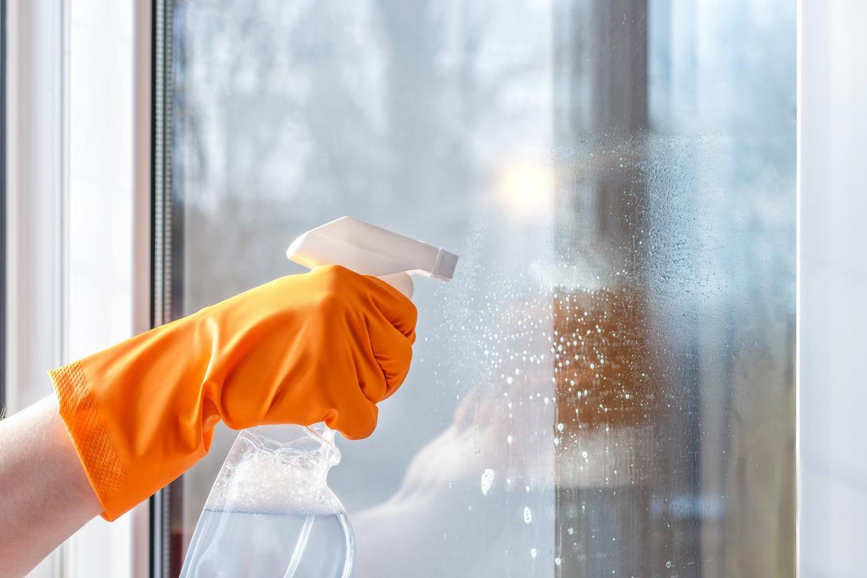 cleaning windows using cleaning product