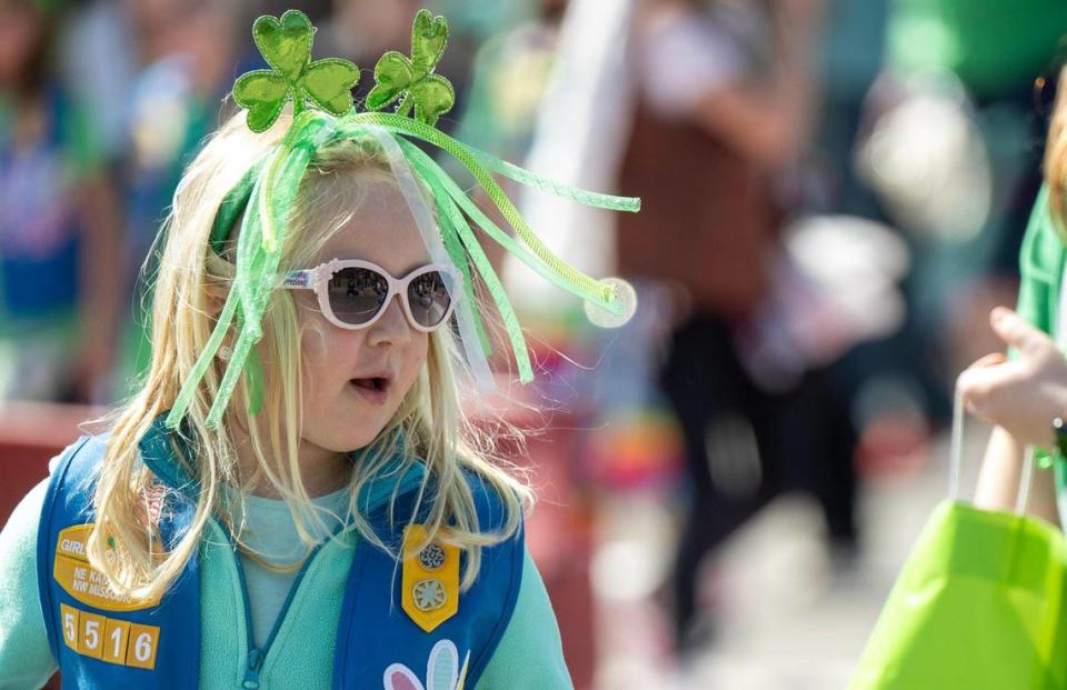 Girls Scouts tossed candy to the crowd as they walked in the 38th annual Shawnee St. Patrick’s Day Parade on Sunday, March 10, 2024.