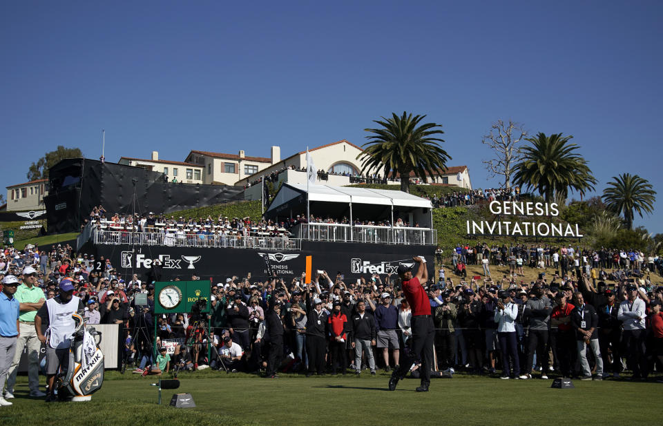 Tiger Woods tees off on the 10th hole during the final round of the Genesis Invitational golf tournament at Riviera Country Club, Sunday, Feb. 16, 2020, in the Pacific Palisades area of Los Angeles. (AP Photo/Ryan Kang)