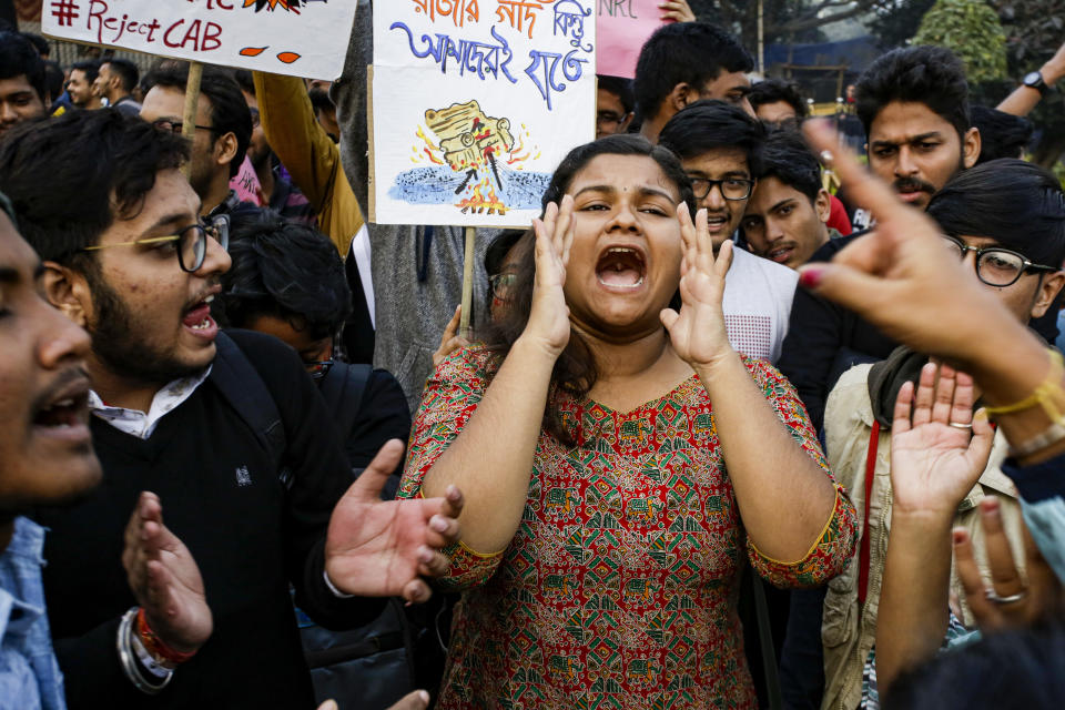 Indian students shout slogans during a protest rally against the Citizenship Amendment Act, in Kolkata, India, Saturday, Dec. 21, 2019. Critics have slammed the law as a violation of India's secular constitution and have called it the latest effort by the Modi government to marginalize the country's 200 million Muslims. Modi has defended the law as a humanitarian gesture. (AP Photo/Bikas Das)