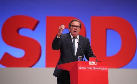 Former German Chancellor Gerhard Schroeder delivers his speech at the Social Democratic party (SPD) convention in Dortmund, Germany, June 25, 2017. REUTERS/Wolfgang Rattay/Files