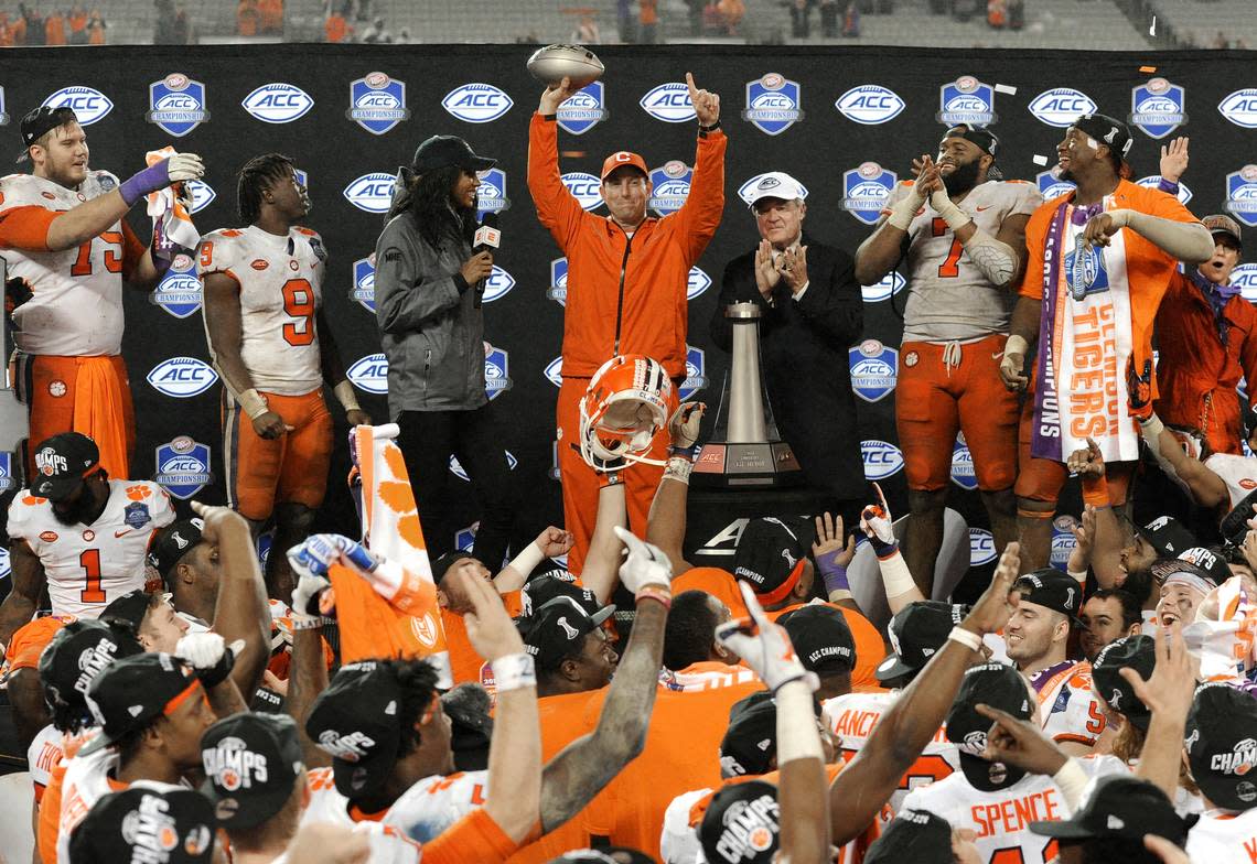 Clemson head coach Dabo Swinney raises the trophy after Clemson won the Atlantic Coast Conference championship NCAA college football game against Pittsburgh in Charlotte, N.C., Saturday, Dec. 1, 2018.