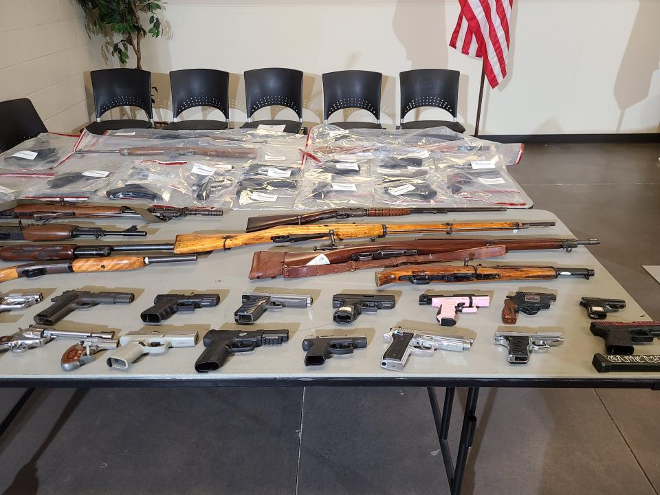 Columbus police display some of the approximately 1,500 guns Chief Elaine Bryant said have been seized or recovered in the city thus far in 2022.