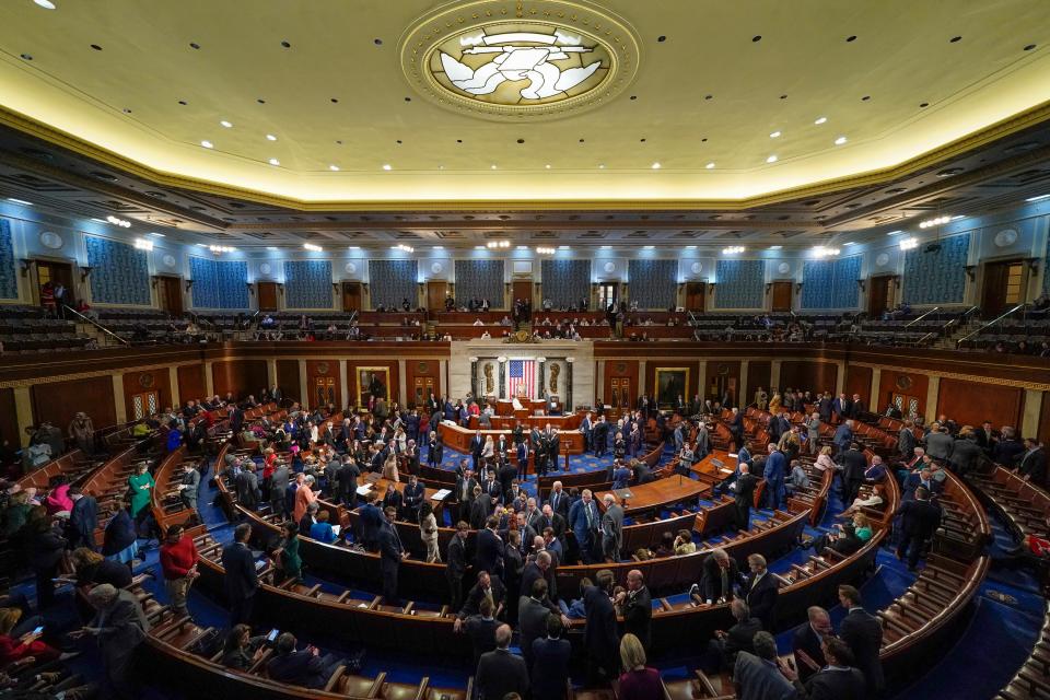 Members talk in the House chamber as the House meets for a second day to elect a speaker and convene the 118th Congress in Washington Wednesday, Jan. 4, 2023.