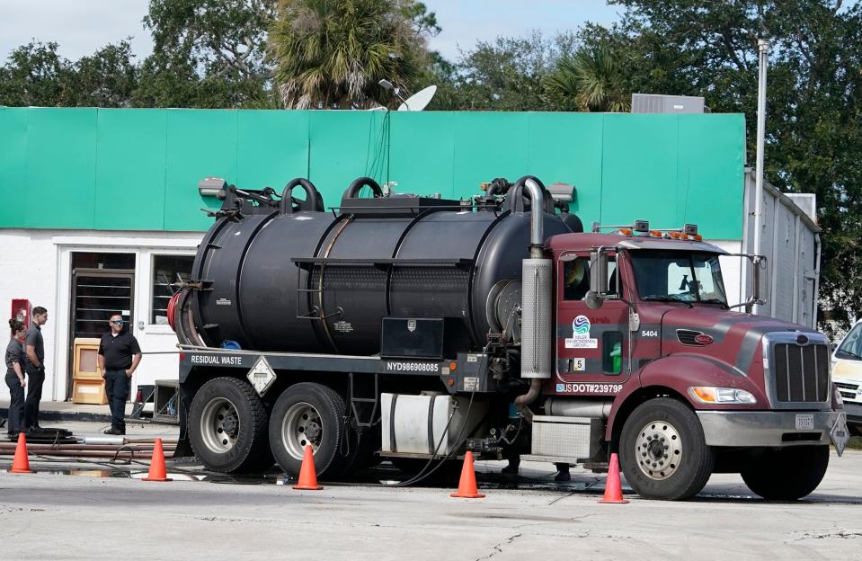New Smyrna Beach Fire Department officials investigate an incident where a fuel tanker reportedly caught fire at the Banana/Texaco gas station in New Smyrna Beach, Monday, Oct. 24, 2022.