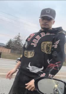 The outstanding suspect wanted by Peel police after a road rage incident in Brampton on March 27, 2024 is shown in this screenshot of video posted to social media. (Peel Regional Police handout - image credit)
