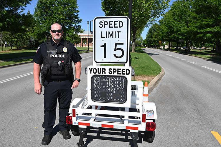 <em>Middle Tennessee State University Police Lt. Jon Leverette shows off the department’s new radar speed trailer, which the department applied for and purchased with the help of a Tennessee Highway Safety Office grant. (MTSU photo by Stephanie Wagner)</em>