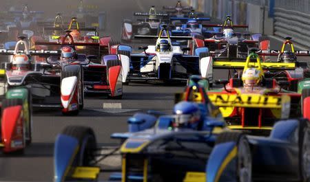 Formula E cars drive into a corner during the Formula E Championship race in Beijing in this September 13, 2014 file photo. REUTERS/Barry Huang/Files