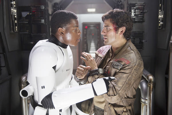 John Boyega and Oscar Isaac having a tense discussion.